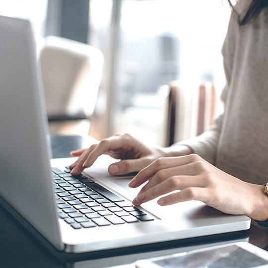 hands with a laptop