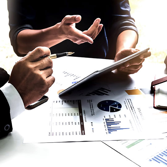 close up of man pointing at tablet