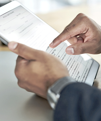 hands holding a tablet
