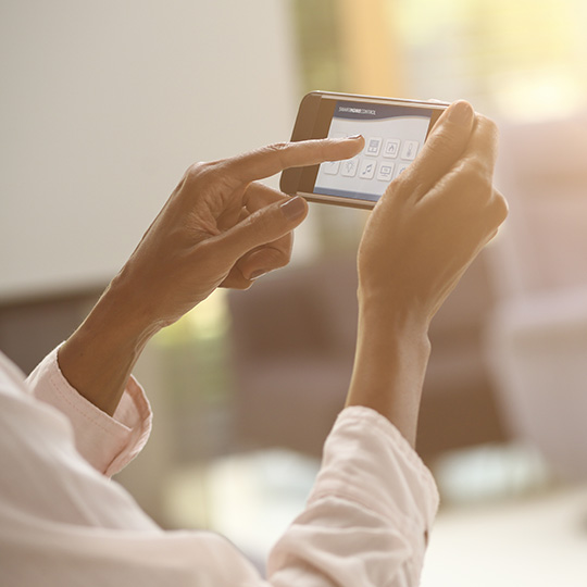 close up of hands holding smartphone