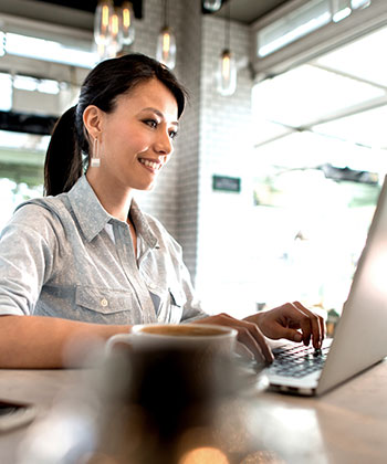 woman typing on laptop