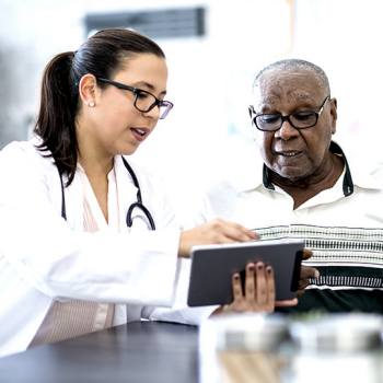 doctor showing patient some files