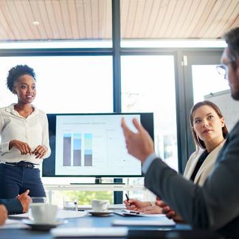 Why going paperless is important? group of colleagues in meeting