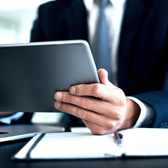 How to take care of information security close up of businessman using tablet