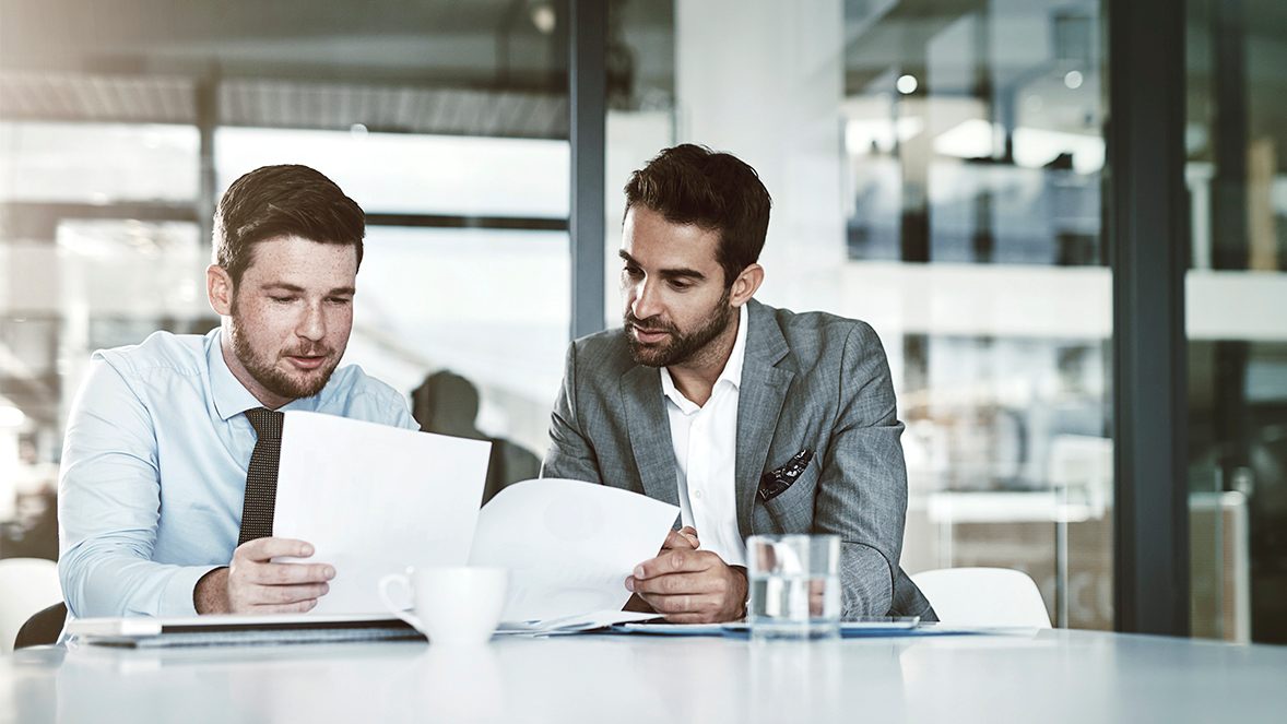 men looking to papers men looking to papers
