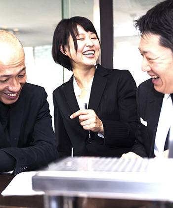 Improve relationships colleagues laughing in a meeting