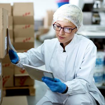 woman looking into a tablet